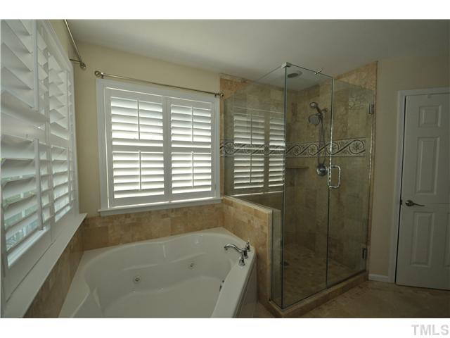 2109 Wide River Drive Raleigh, NC 27614 - Photo 12 of 20 a bathroom with a shower and a vanity