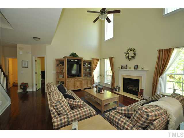 2109 Wide River Drive Raleigh, NC 27614 - Photo 5 of 20 a living room with furniture and a fireplace
