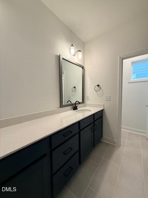 108 Swain Street Clayton, NC 27520 - Photo 13 of 19 a bathroom with a double vanity sink and a mirror