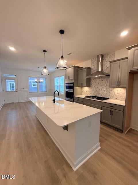 108 Swain Street Clayton, NC 27520 - Photo 5 of 19 a large kitchen with kitchen island a large counter space a sink appliances and cabinets