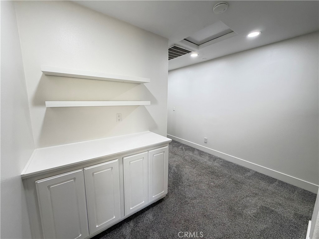 9494 Jack Rabbit Drive Rancho Cucamonga, CA 91730 - Photo 19 of 45 Stairway Landing With Built In Cabinets