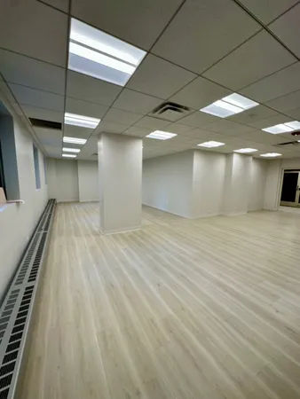 a view of a workspace with a flat screen tv
