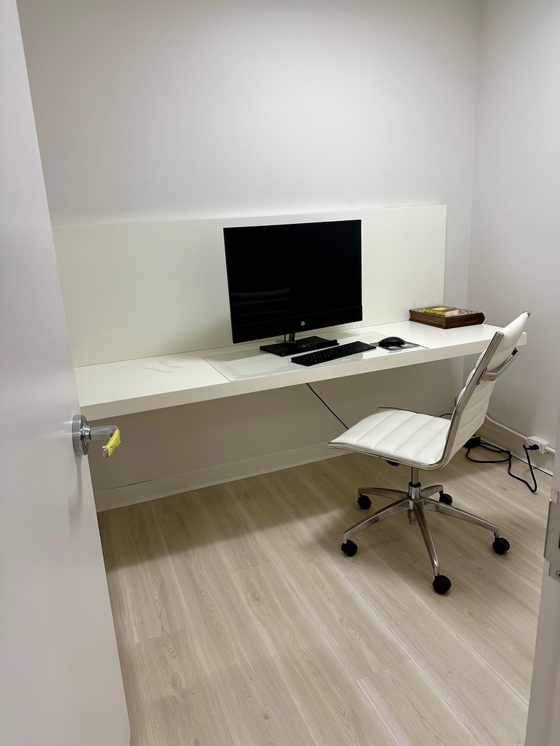 400 East Randolph Street, Unit 706 Chicago, IL 60601 - Photo 12 of 21 a view of a workspace with a flat screen tv