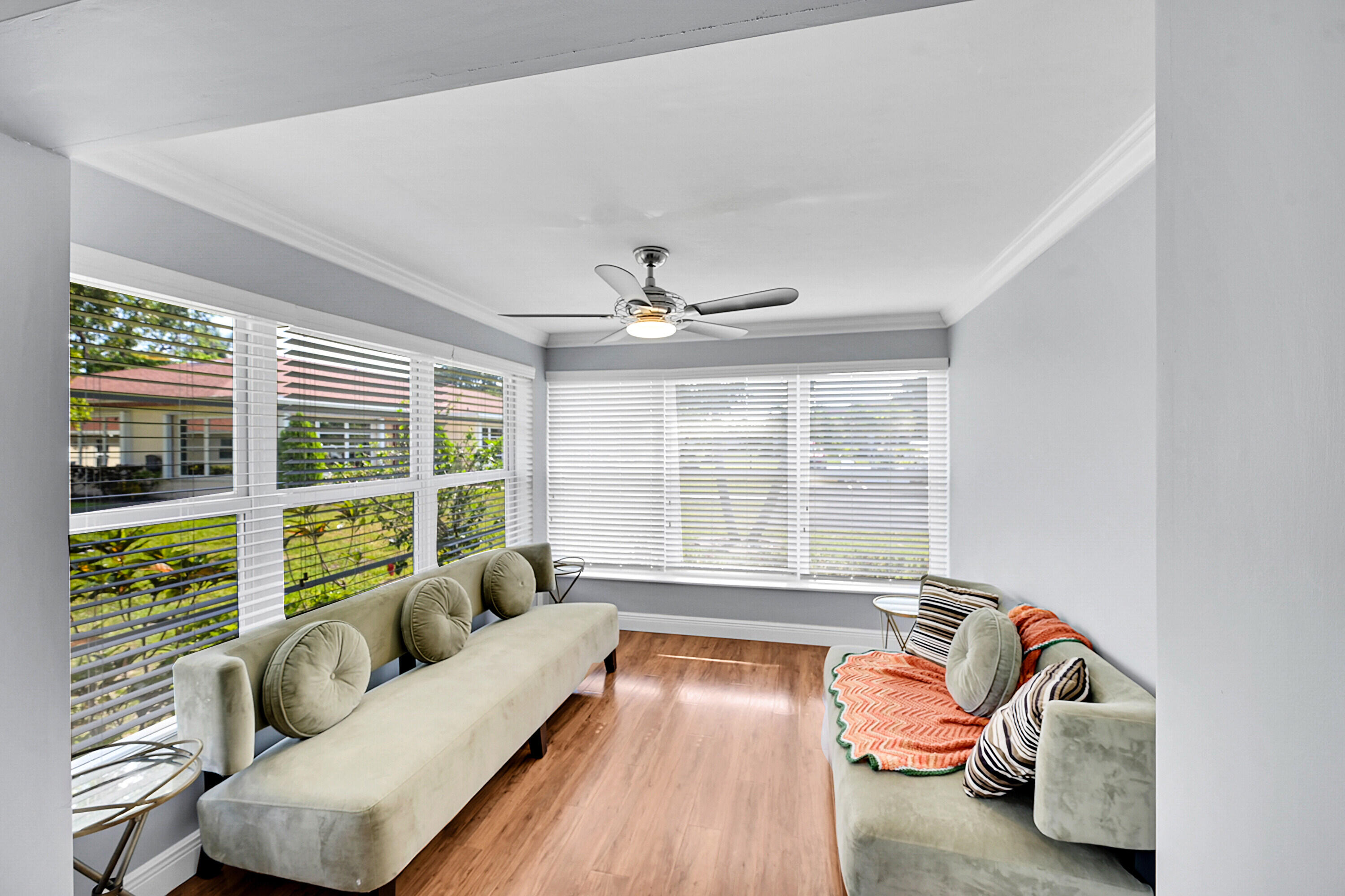 4585 Northwest 3rd Street, Unit D Delray Beach, FL 33445 - Photo 11 of 45 a living room with furniture and a large window
