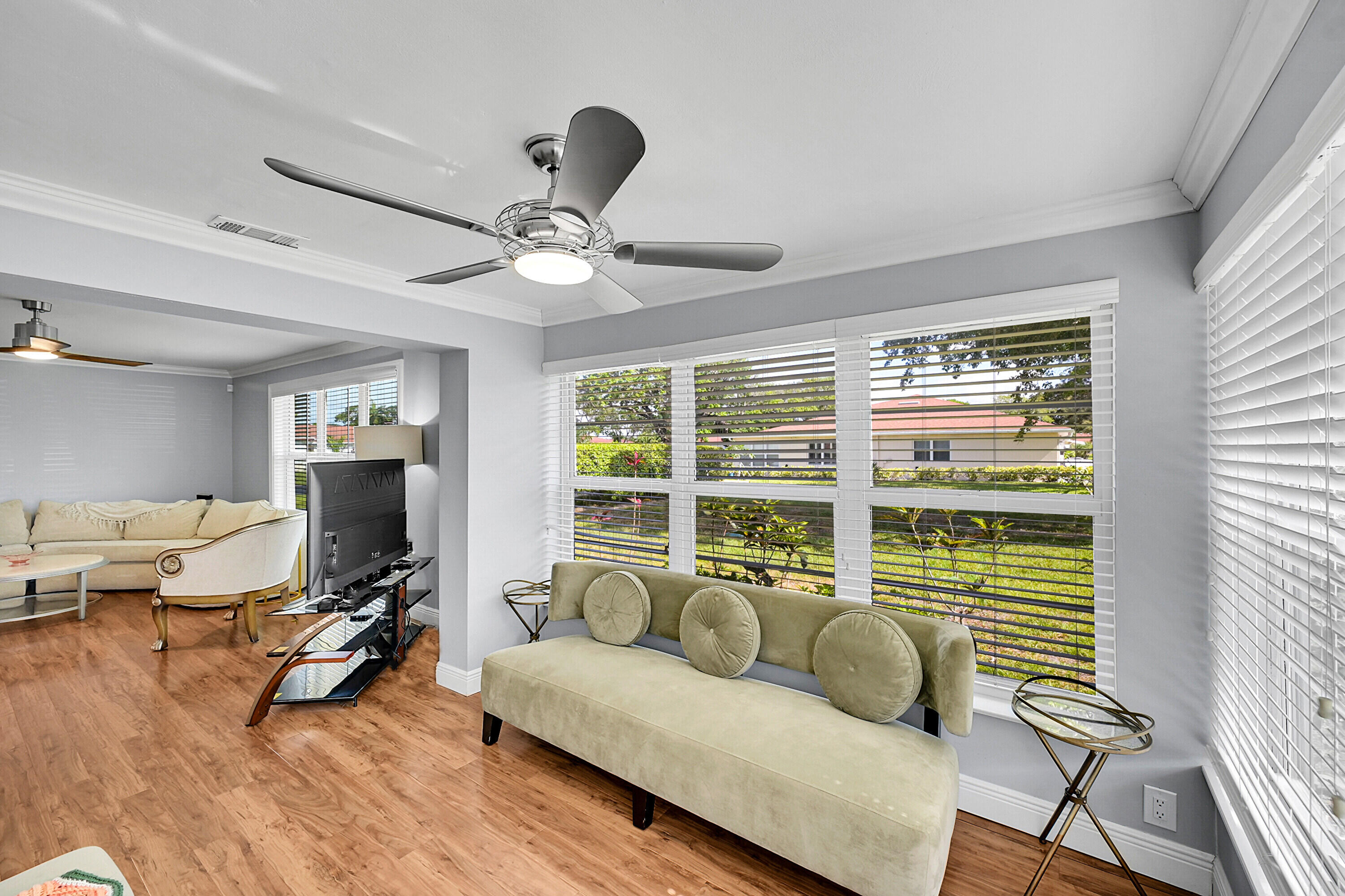 4585 Northwest 3rd Street, Unit D Delray Beach, FL 33445 - Photo 13 of 45 a living room with furniture and a large window