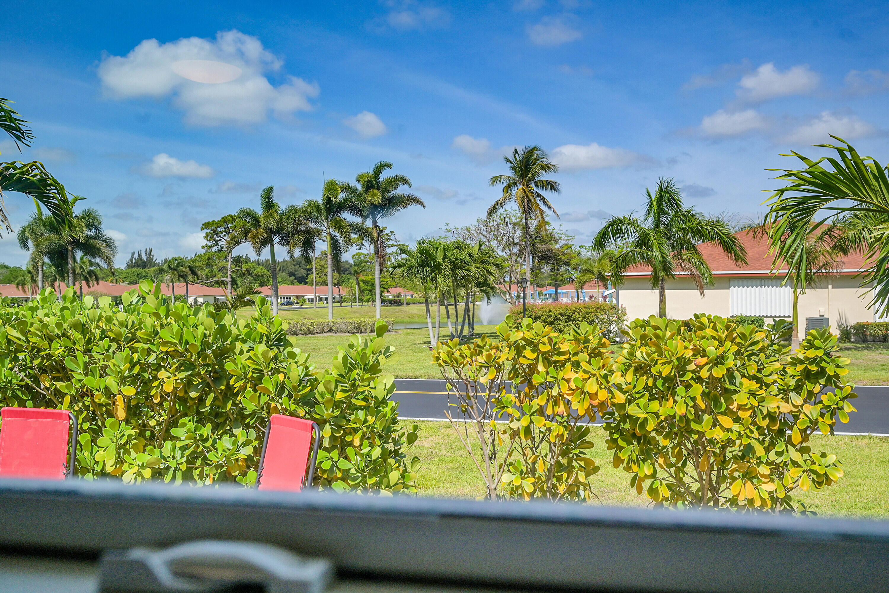 4585 Northwest 3rd Street, Unit D Delray Beach, FL 33445 - Photo 25 of 45 a view of a street from a window