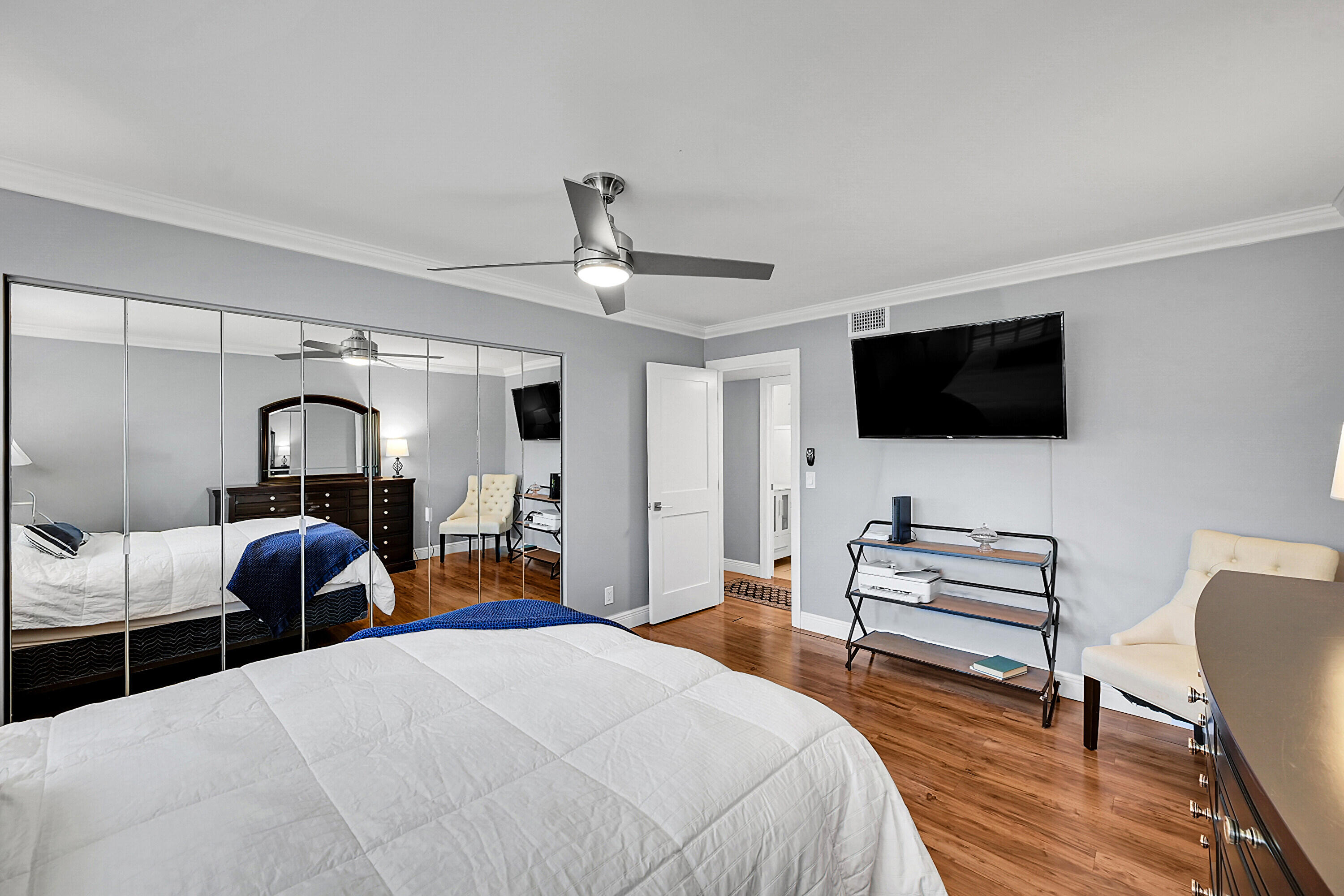 4585 Northwest 3rd Street, Unit D Delray Beach, FL 33445 - Photo 27 of 45 a bedroom with bed and tv