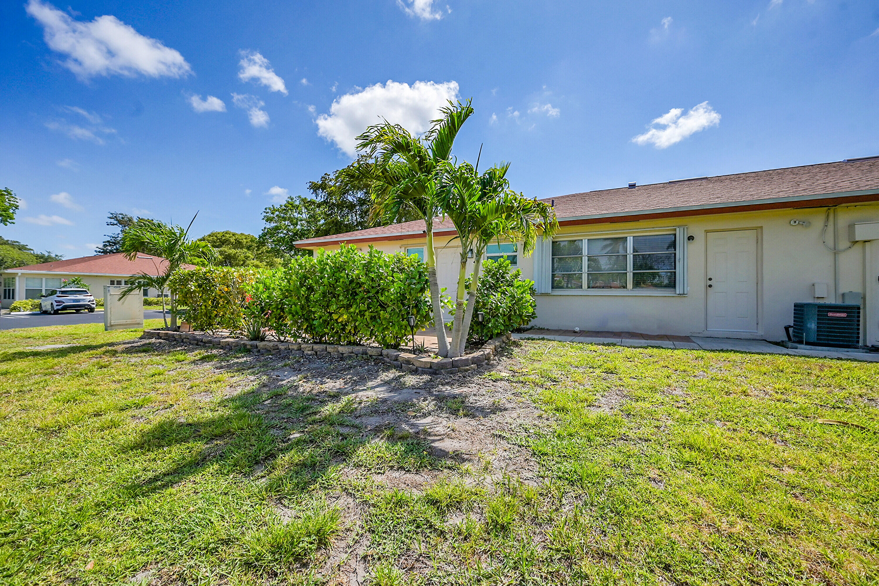 4585 Northwest 3rd Street, Unit D Delray Beach, FL 33445 - Photo 36 of 45 a house with a yard