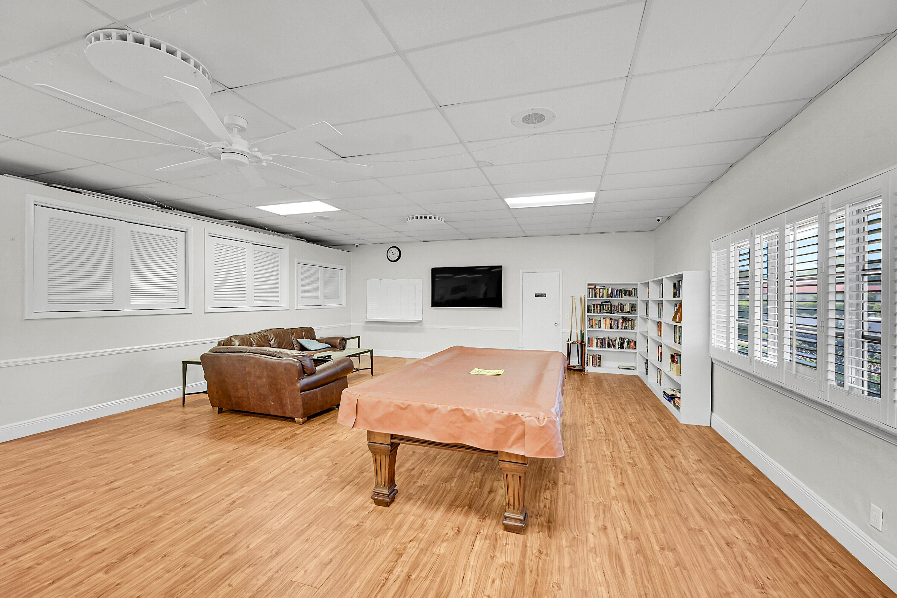 4585 Northwest 3rd Street, Unit D Delray Beach, FL 33445 - Photo 40 of 45 a living room with furniture and a flat screen tv