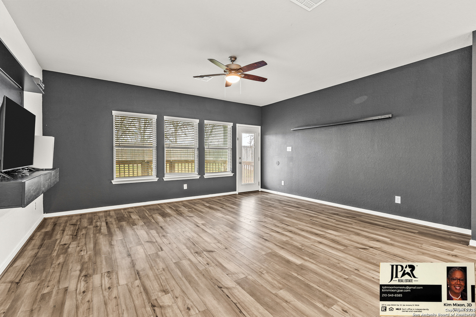 3306 Junction Bay Converse, TX 78109 - Photo 11 of 23 a view of an empty room with a window and wooden floor