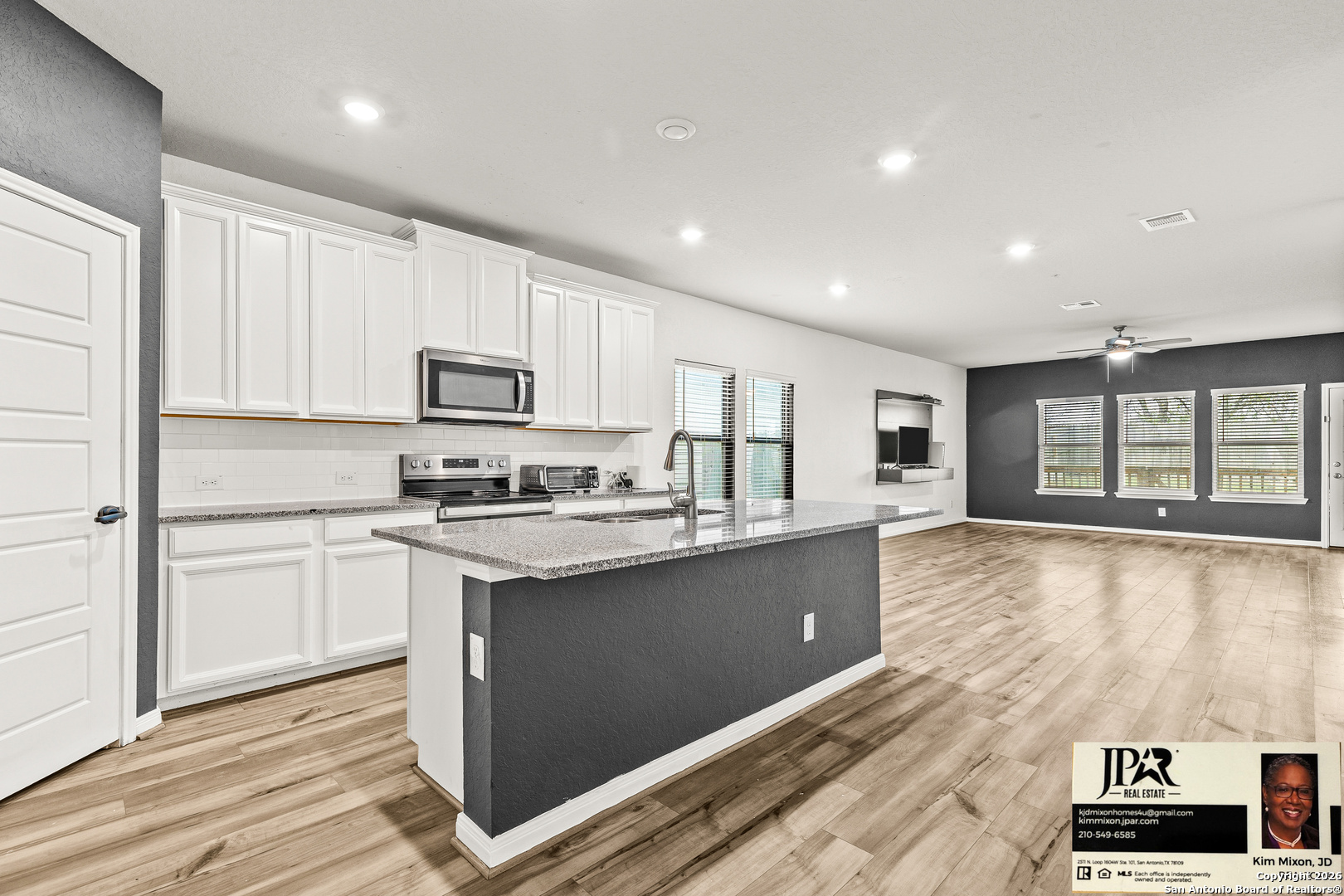 3306 Junction Bay Converse, TX 78109 - Photo 3 of 23 a kitchen with a sink window and cabinets