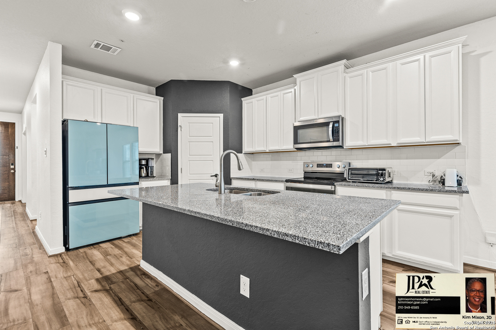 3306 Junction Bay Converse, TX 78109 - Photo 4 of 23 a kitchen with stainless steel appliances granite countertop a stove a sink and a refrigerator