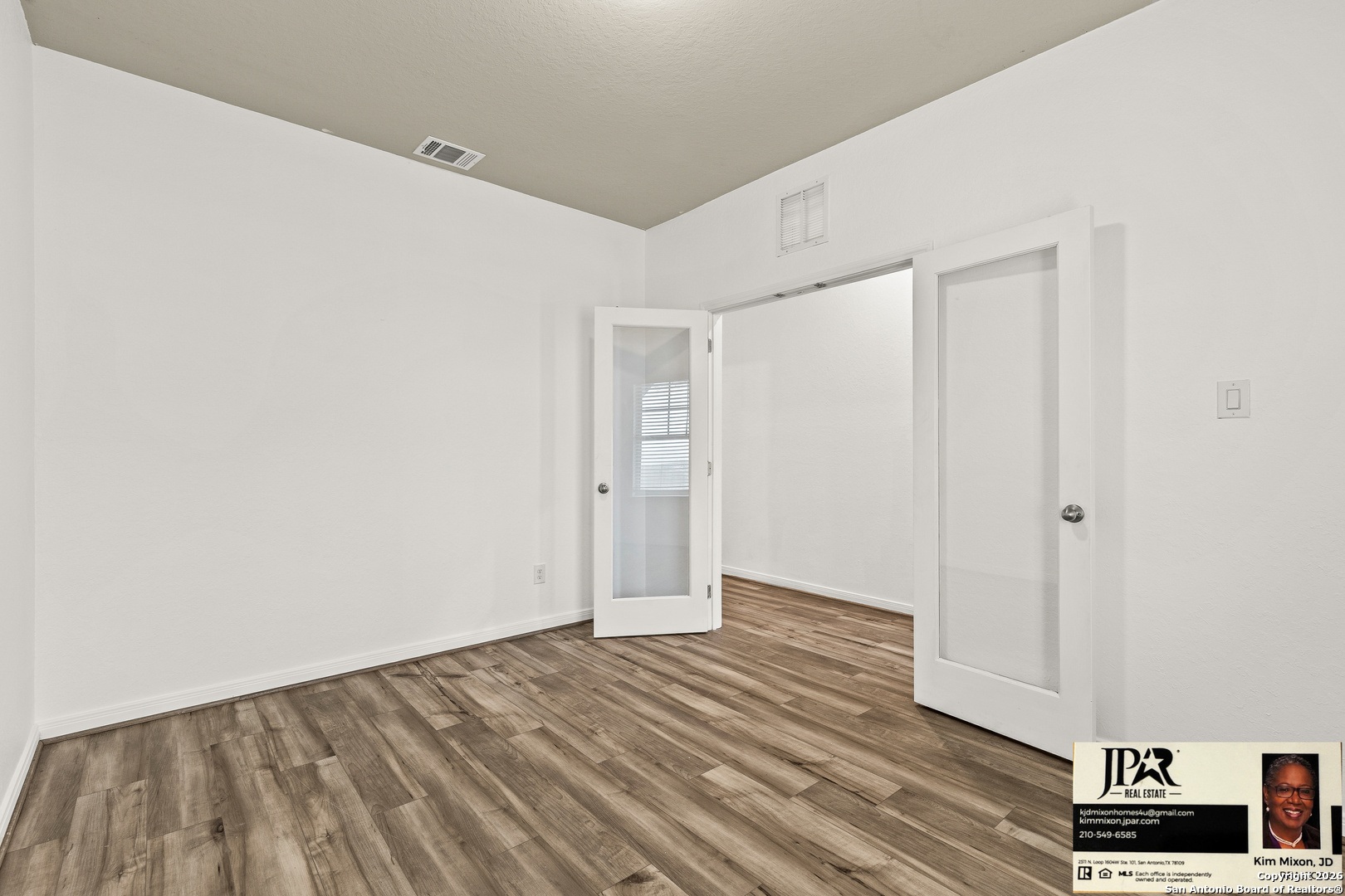 3306 Junction Bay Converse, TX 78109 - Photo 8 of 23 a view of an empty room with wooden floor and a window