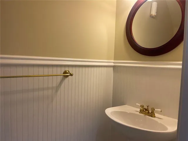 a bathroom with a sink and mirror