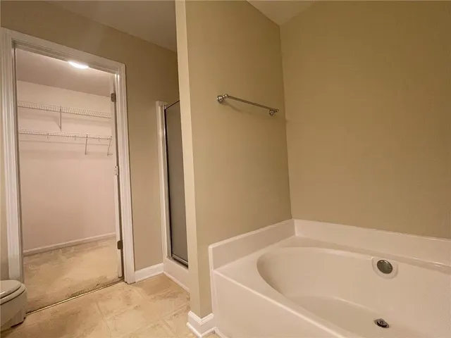 a white toilet sitting next to a bathroom sink