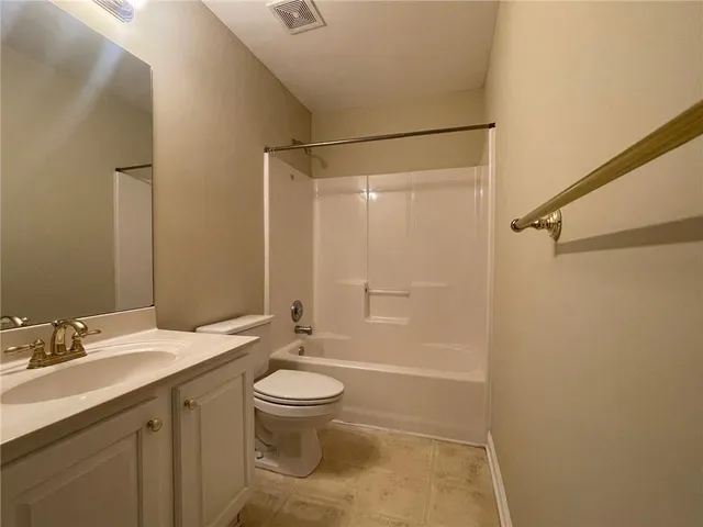 a view of a house that has a door and a window