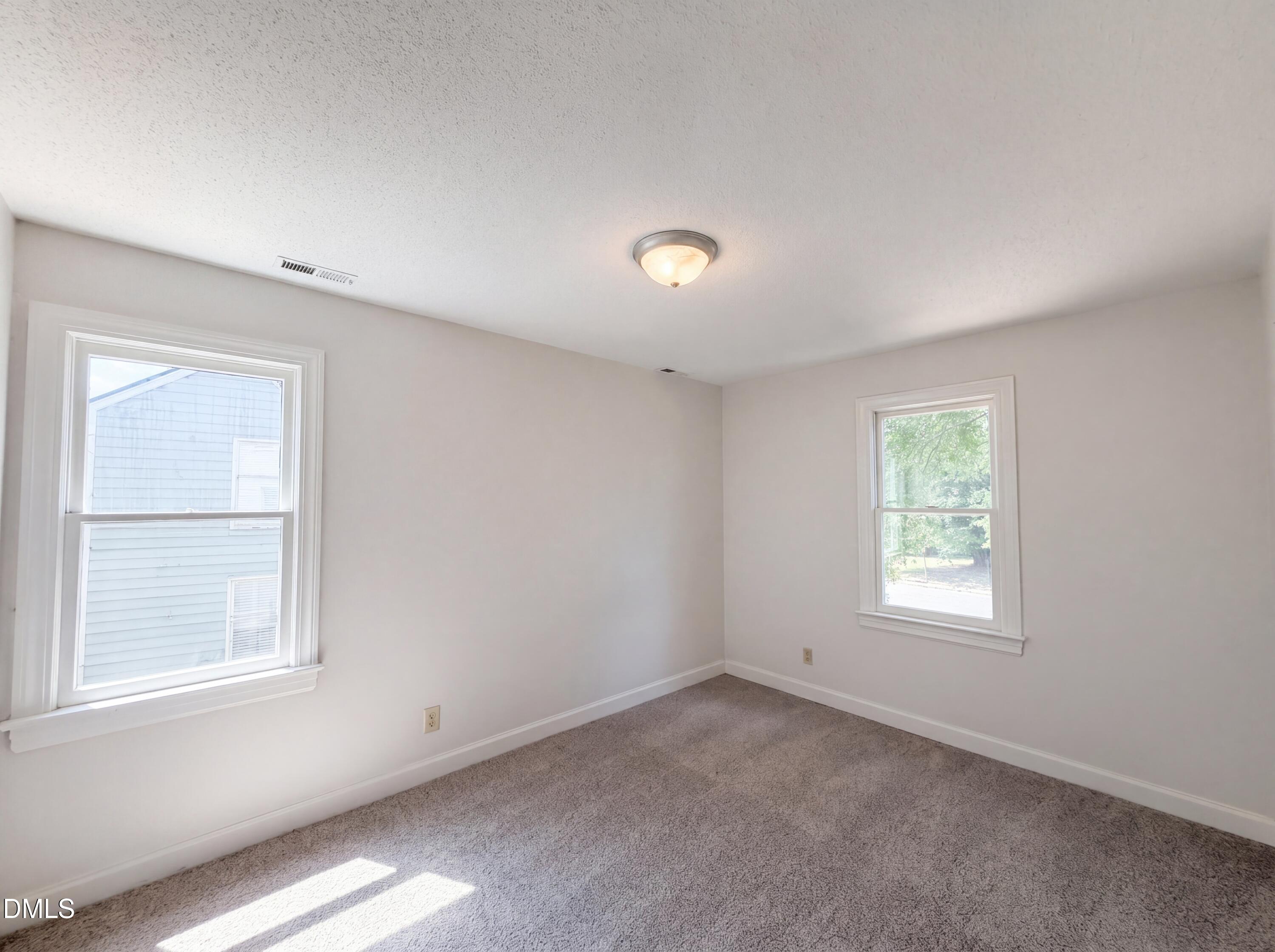 3921 Iron Horse Road Raleigh, NC 27616 - Photo 8 of 20 an empty room with a window