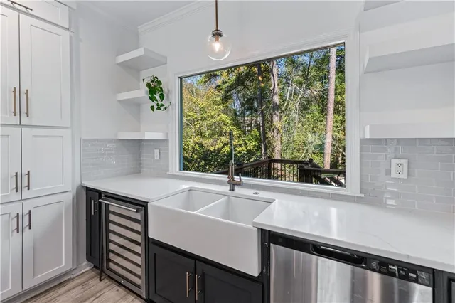 a kitchen with a sink and large window