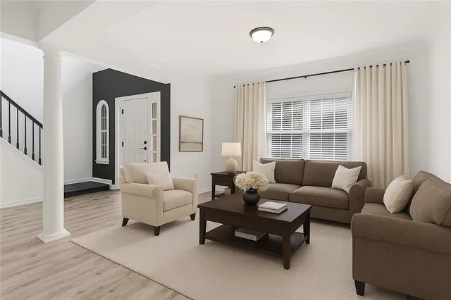 a living room with furniture and a window