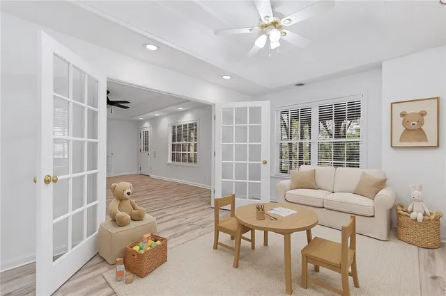 a living room with furniture and a large window
