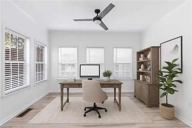 a workspace with furniture and a window