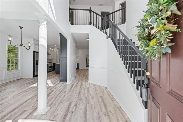 a view of entryway with wooden floor