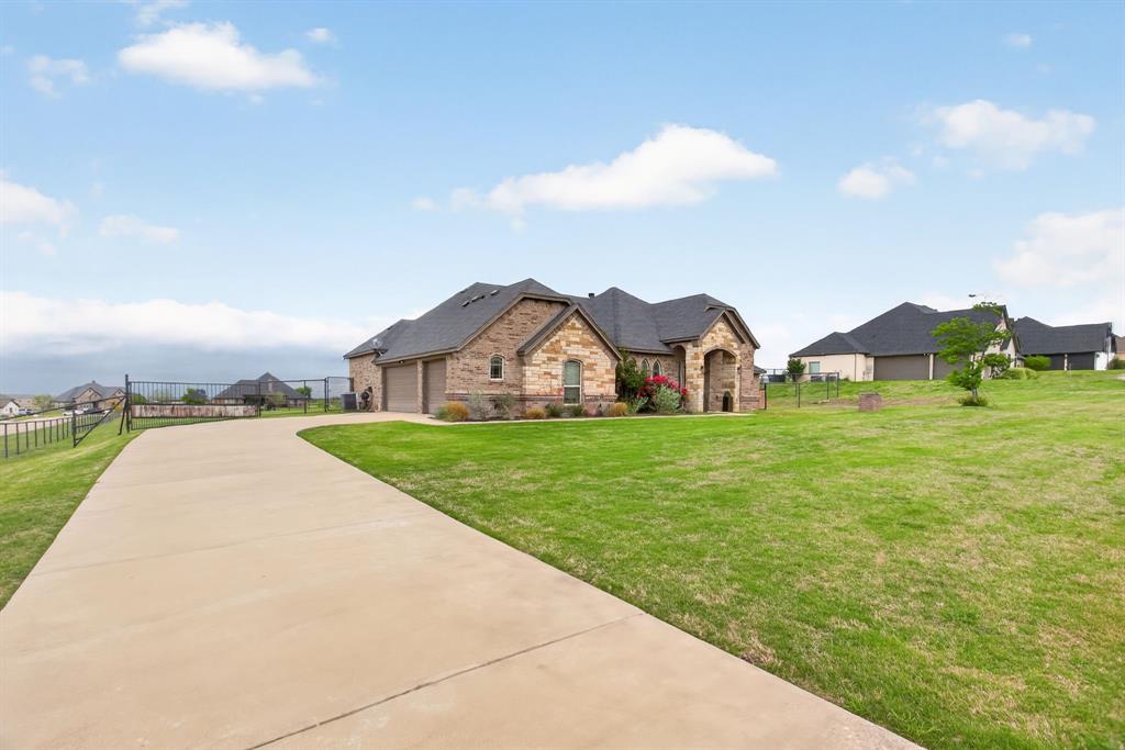 7320 Spring Ranch Court Godley, TX 76044 - Photo 28 of 38 a view of a house with a big yard and large tree