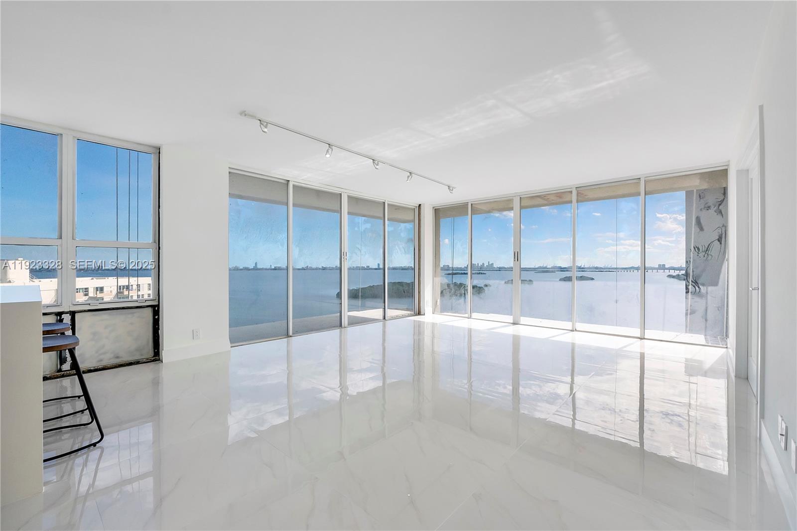 780 Northeast 69th Street, Unit 1601 Miami, FL 33138 - Photo 1 of 18 a view of an empty room with kitchen