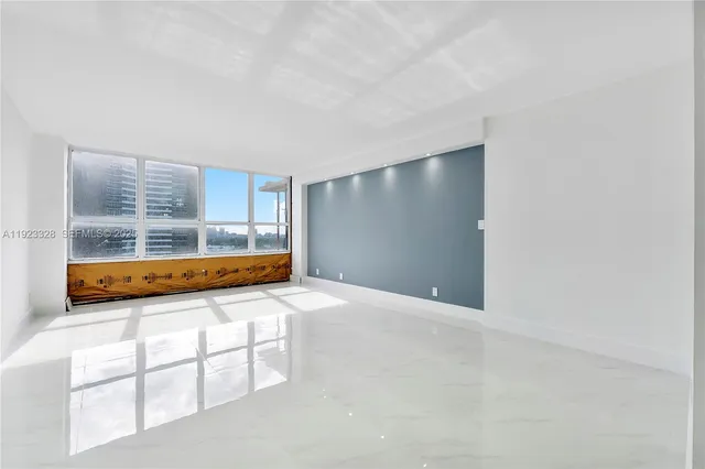 a view of a hallway with washer and dryer