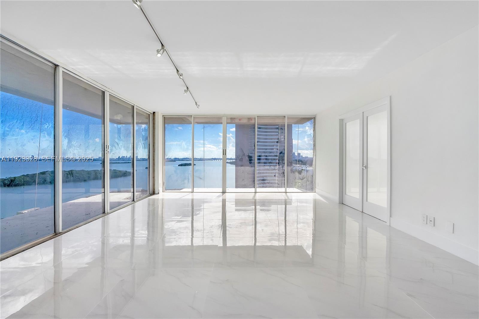 780 Northeast 69th Street, Unit 1601 Miami, FL 33138 - Photo 2 of 18 a view of an empty room with window