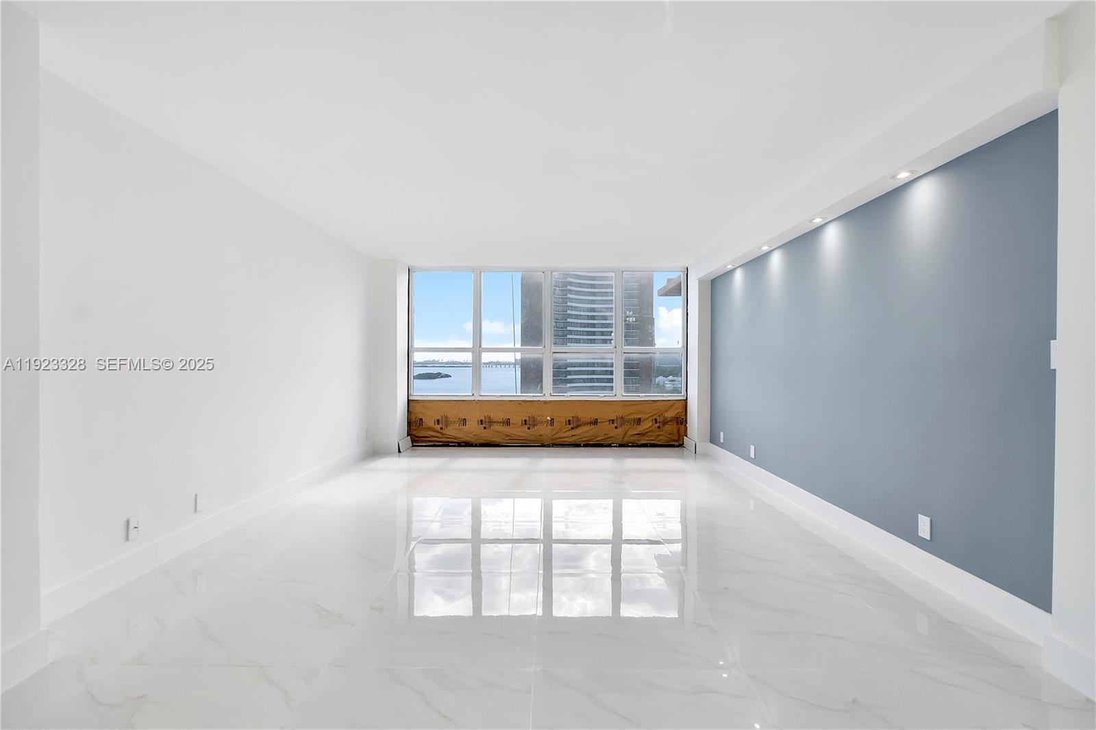 780 Northeast 69th Street, Unit 1601 Miami, FL 33138 - Photo 4 of 18 an empty room with windows