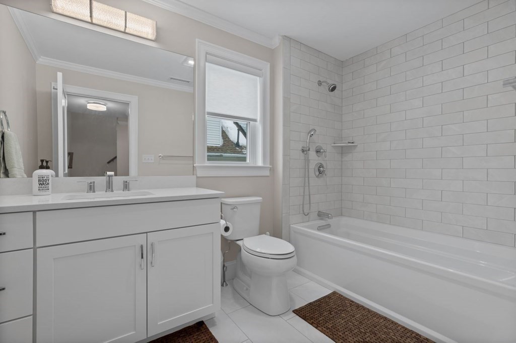 46 Murray Hill Road Boston, MA 02131 - Photo 11 of 25 a bathroom with a sink a toilet and shower