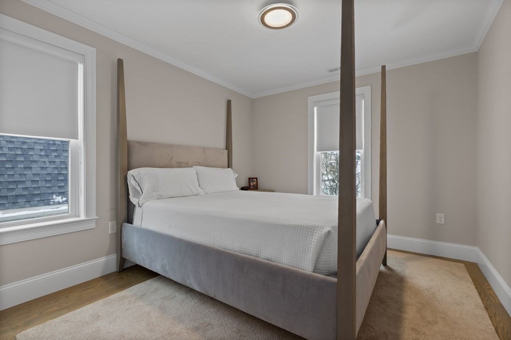 46 Murray Hill Road Boston, MA 02131 - Photo 12 of 25 a bed room with a bed and a window