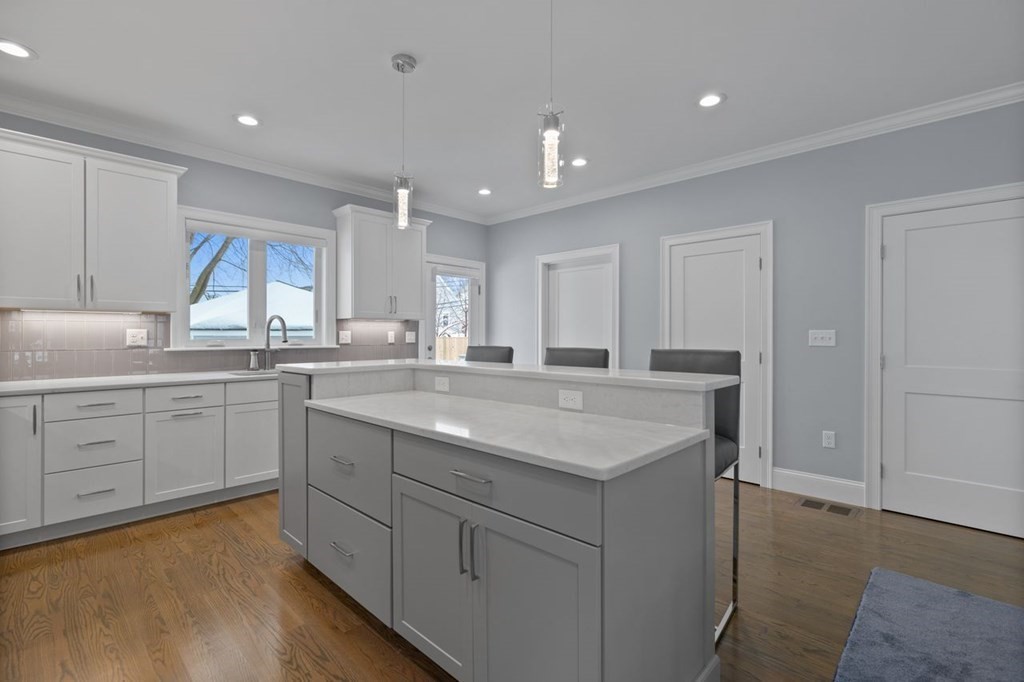 46 Murray Hill Road Boston, MA 02131 - Photo 3 of 25 a kitchen with sink stove and cabinets