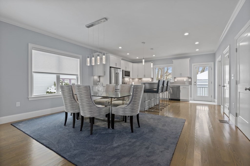 46 Murray Hill Road Boston, MA 02131 - Photo 4 of 25 a view of a dining room with furniture and wooden floor