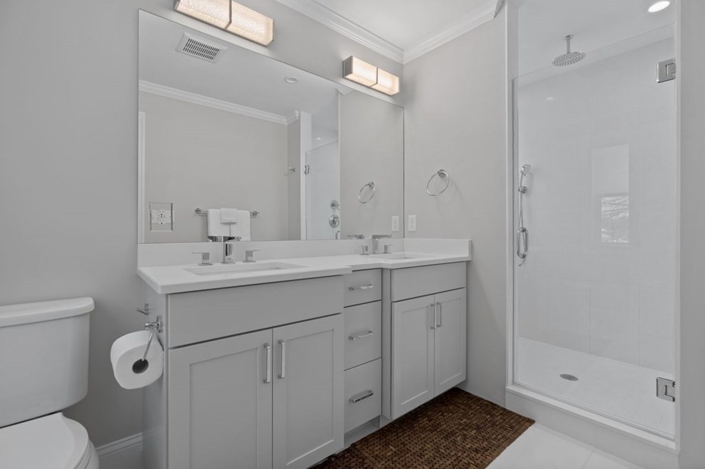 46 Murray Hill Road Boston, MA 02131 - Photo 9 of 25 a bathroom with a shower sink mirror and toilet