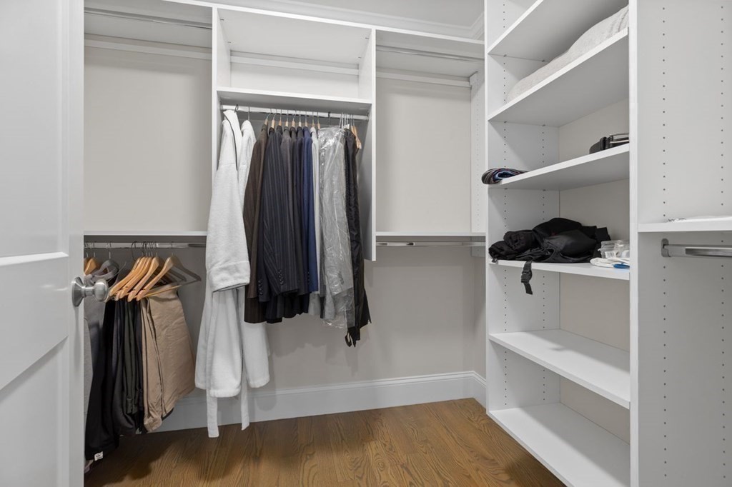 46 Murray Hill Road Boston, MA 02131 - Photo 10 of 25 a view of walk in closet with clothes and shoes