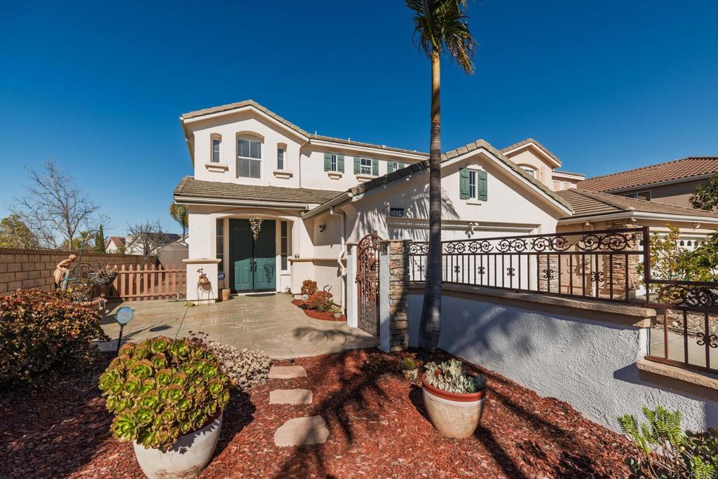a view of a house with pool and sitting area