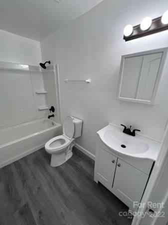 1962 Lakeview Road, Unit A Asheboro, NC 27203 - Photo 3 of 17 a bathroom with a sink a toilet and shower