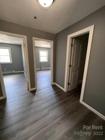 1962 Lakeview Road, Unit A Asheboro, NC 27203 - Photo 5 of 17 a view of a hallway with wooden floor