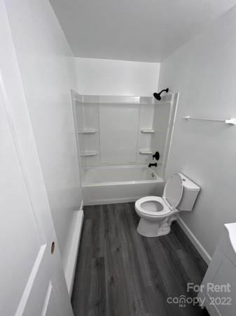 1962 Lakeview Road, Unit A Asheboro, NC 27203 - Photo 8 of 17 a bathroom with a toilet and a shower
