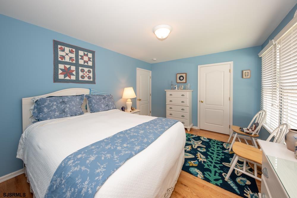 336 West Surf Road Ocean City, NJ 08226 - Photo 11 of 29 a bedroom with a bed and a dresser
