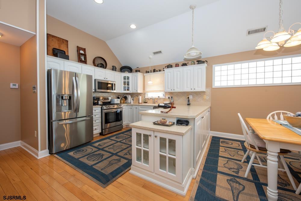 336 West Surf Road Ocean City, NJ 08226 - Photo 13 of 29 a kitchen with stainless steel appliances a stove a refrigerator and a refrigerator