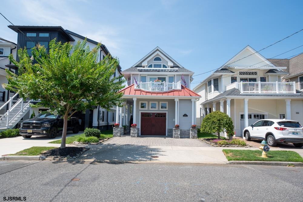 336 West Surf Road Ocean City, NJ 08226 - Photo 2 of 29 a front view of a house with a yard and garage