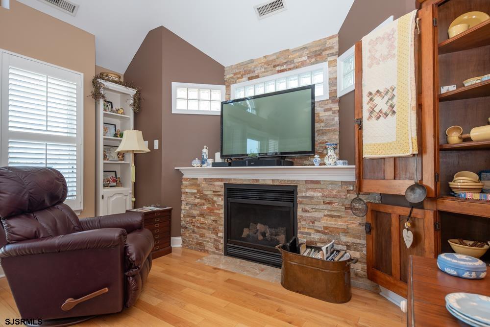336 West Surf Road Ocean City, NJ 08226 - Photo 21 of 29 a living room with furniture and a fireplace