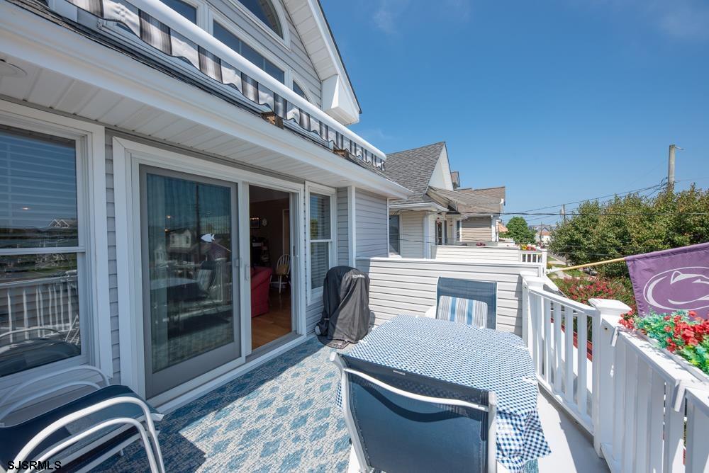 336 West Surf Road Ocean City, NJ 08226 - Photo 25 of 29 a view of a patio with couches table and chairs and potted plants