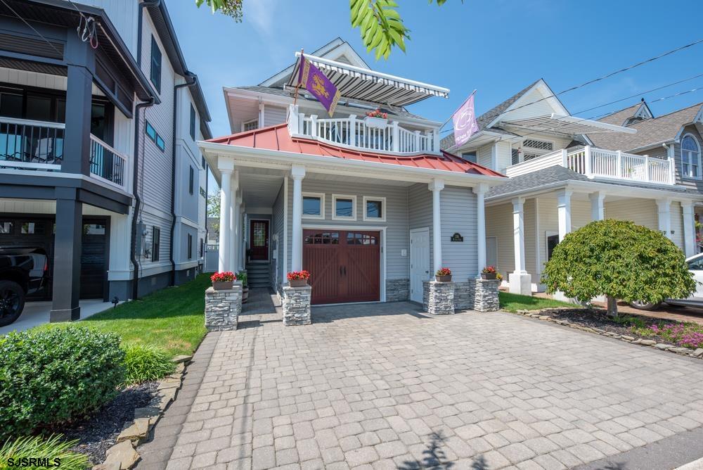 336 West Surf Road Ocean City, NJ 08226 - Photo 3 of 29 a front view of a house with garden and plants