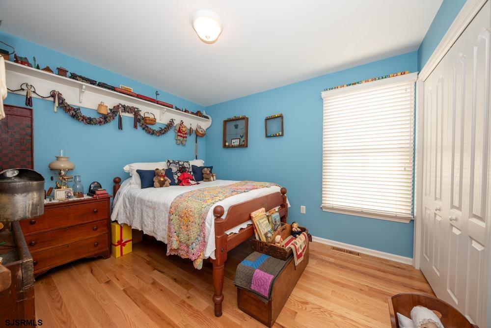 336 West Surf Road Ocean City, NJ 08226 - Photo 8 of 29 a bedroom with a bed and a window