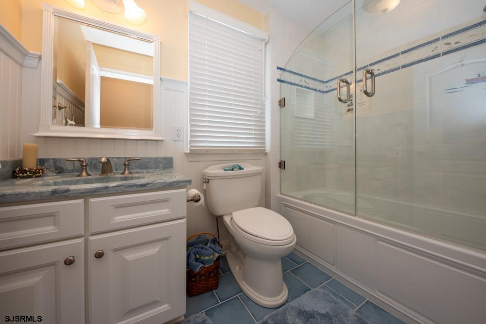 336 West Surf Road Ocean City, NJ 08226 - Photo 9 of 29 a bathroom with a sink toilet and shower