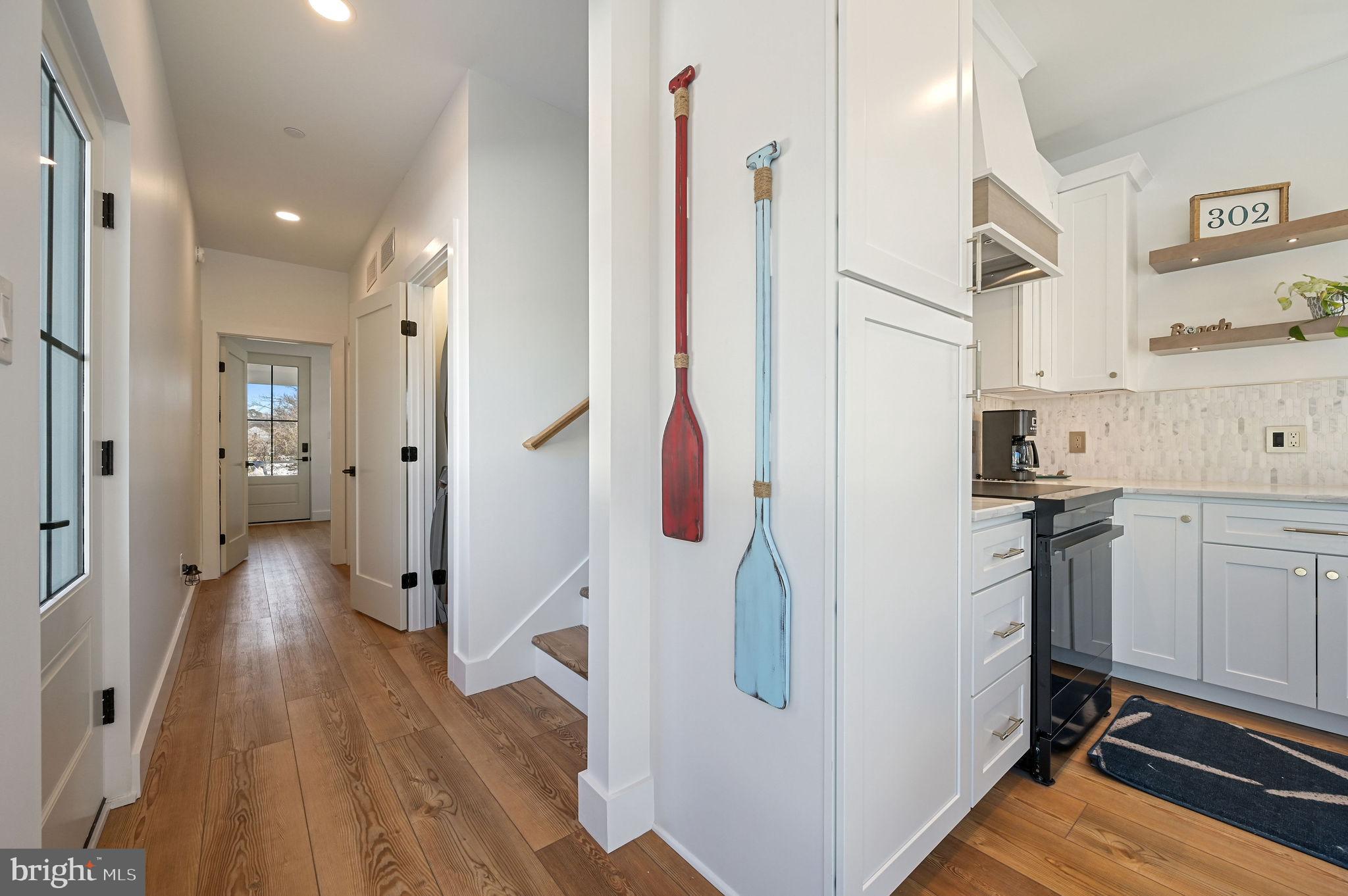 103 A New Road Lewes, DE 19958 - Photo 12 of 31 Hallway leading to 1st floor bed,bath & Laundry!